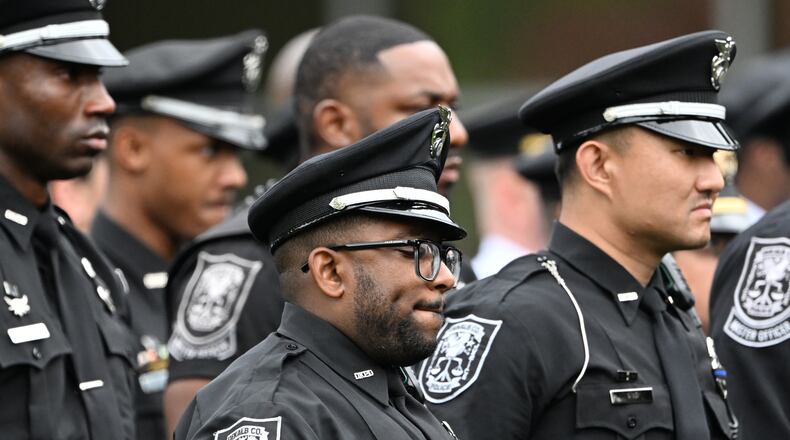 DeKalb County officers attend at a memorial service for officer David Rose, who was killed while responding to the Aug. 8, 2025, shooting at the Centers for Disease Control and Prevention. (Hyosub Shin/AJC 2025)