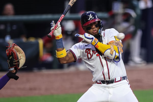 Atlanta Braves' Ronald Acuña Jr. tries to avoid a pitch in the first inning of a baseball game against the Arizona Diamondbacks, Wednesday, June 4, 2025, in Atlanta. (AP Photo/Colin Hubbard)