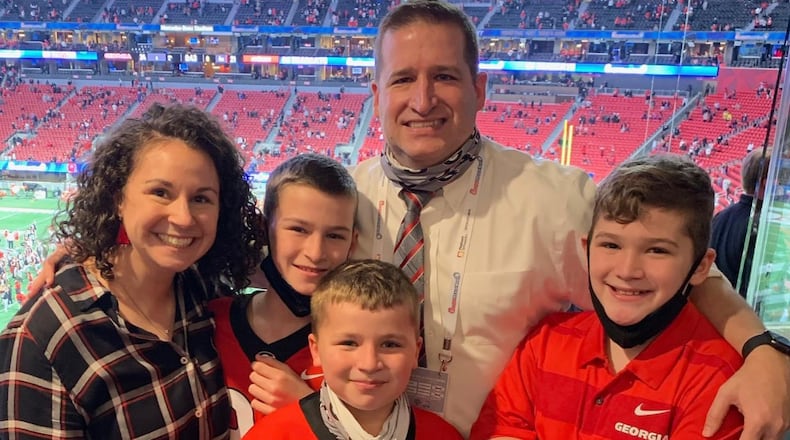 Georgia's first-year Athletic Director Josh Brooks is having to learn how to balance family life while overseeing a $150 million athletic department. (Family photo)