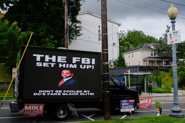 A mobile billboard truck displays a message in support of former District of Columbia Councilman Trayon White outside the Anacostia Neighborhood Library during the Ward 8 special election, Tuesday, July 15, 2025, in Washington. (AP Photo/Julia Demaree Nikhinson)