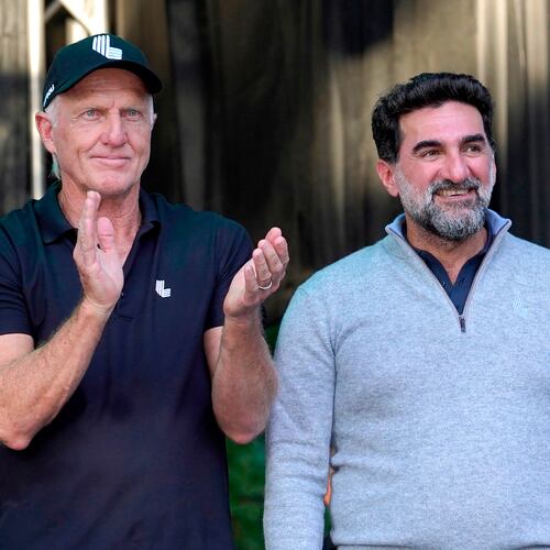 FILE - LIV Golf CEO Greg Norman, left, applauds Yasir Al-Rumayyan, Governor of Public Investment Fund of Saudi Arabia, at the LIV Golf Invitational-Chicago tournament Sept. 18, 2022, in Sugar Hill, Ill. (AP Photo/Charles Rex Arbogast, File)