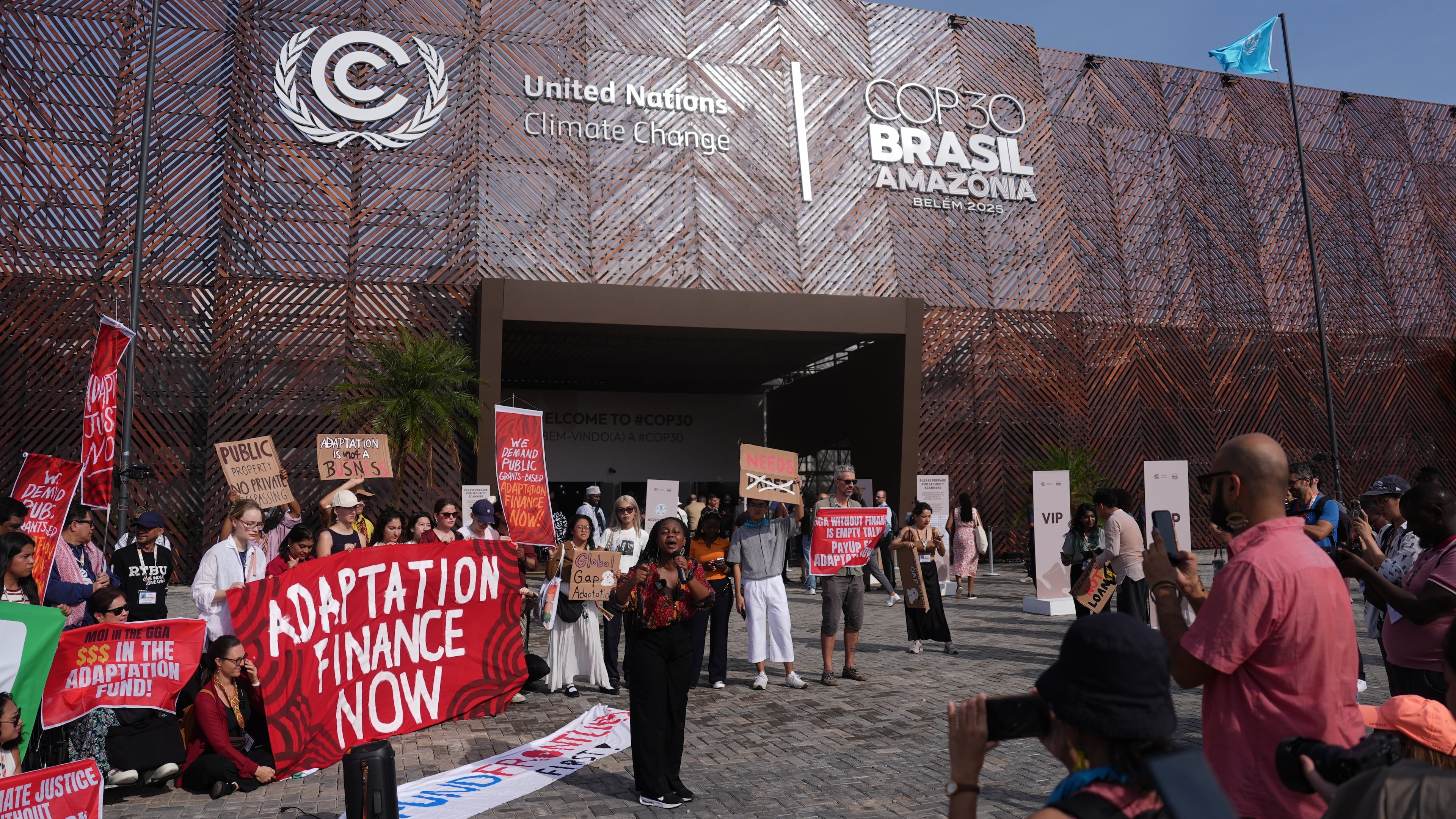 Activists participate in a demonstration for climate finance outside the COP30 U.N. Climate Summit venue, Thursday, Nov. 13, 2025, in Belem, Brazil. (AP Photo/Joshua A. Bickel)