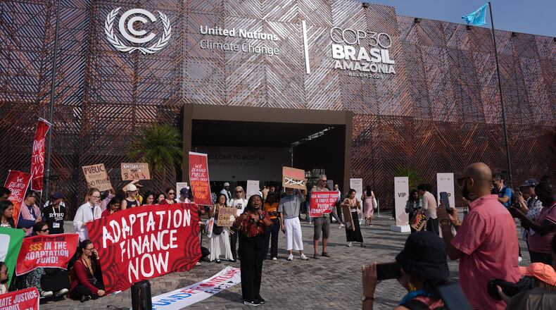 Activists participate in a demonstration for climate finance outside the COP30 U.N. Climate Summit venue, Thursday, Nov. 13, 2025, in Belem, Brazil. (AP Photo/Joshua A. Bickel)