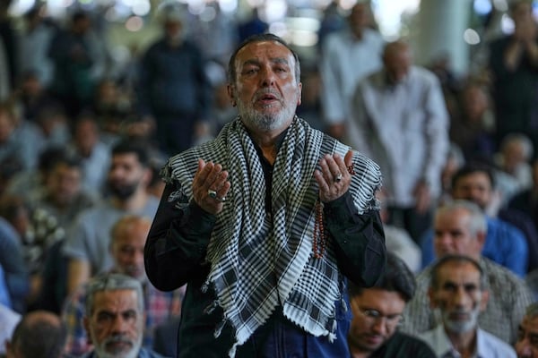 An Iranian worshipper prays as he attends Friday prayers ceremony at Tehran University campus in Tehran, Iran, Friday, June 13, 2025. (AP Photo/Vahid Salemi)