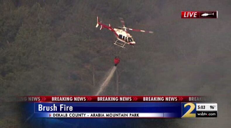 Fire officials worked to extinguish a fire at Arabia Mountain Park.