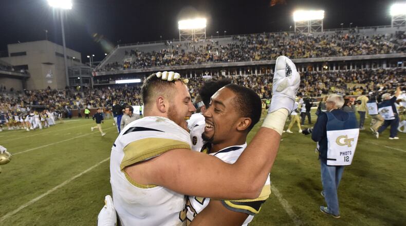 Georgia Tech linebacker Brant Mitchell (left) and Georgia Tech defensive back Malik Rivera celebrate their 30-27 overtime victory over the Virginia at Bobby Dodd Stadium on Saturday, November 17, 20. HYOSUB SHIN / HSHIN@AJC.CO