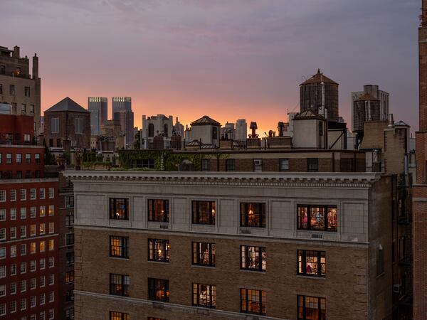 Gail Albert Halaban's “Break The Fast, Yom Kippur, Upper East Side” (2023) is on view at Jackson Fine Art. In her "Neighbors in Buildings" series, viewers can immerse themselves in contemplating the diverse lives led by neighboring New Yorkers.