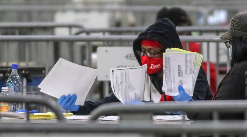 January 5, 2021 Atlanta: Fulton County Election Workers opened and sorted ballots on Tuesday, Jan. 5, 2021 at the Georgia World Congress Center in downtown Atlanta before 7 pm when they were then allowed to scan them. Georgia’s long moment in the national spotlight culminated Tuesday, Jan. 5, 2021, when state voters cast their votes to determine which party would control the U.S. Senate. Georgia voters also voted to elect a member of the state Public Service Commission, which regulates energy and utility rates and issues. The two most expensive Senate races in history saw more than $833 million been spent by the four campaigns and outside groups supporting them, blanketing the airwaves and stuffing mailboxes across the state. Much of that money has come from organizations with no direct connection to Georgia. (John Spink / John.Spink@ajc.com)