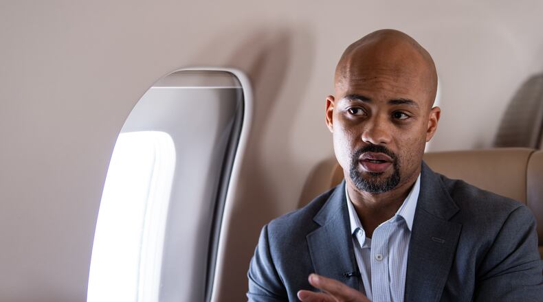 Atlanta Falcons General Manager Terry Fontenot gestures as he talks during the jet ride to Atlanta, Georgia, on Thursday January 21, 2021.