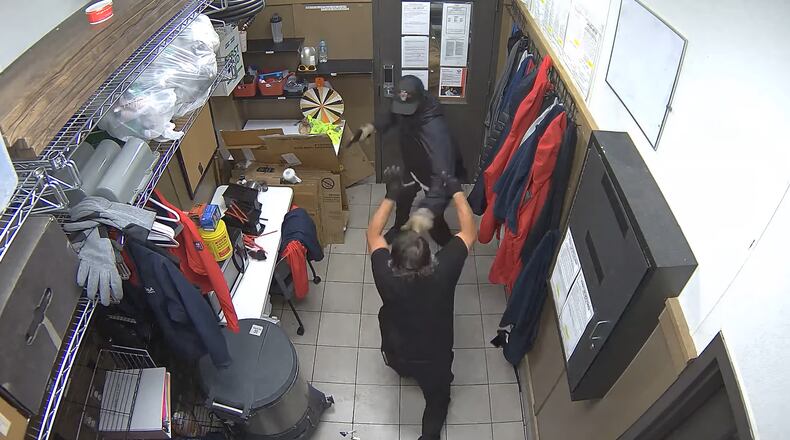 A Chick-fil-A delivery driver fought off a would-be robber at a Gwinnett County restaurant July 1. The suspect was arrested Wednesday.