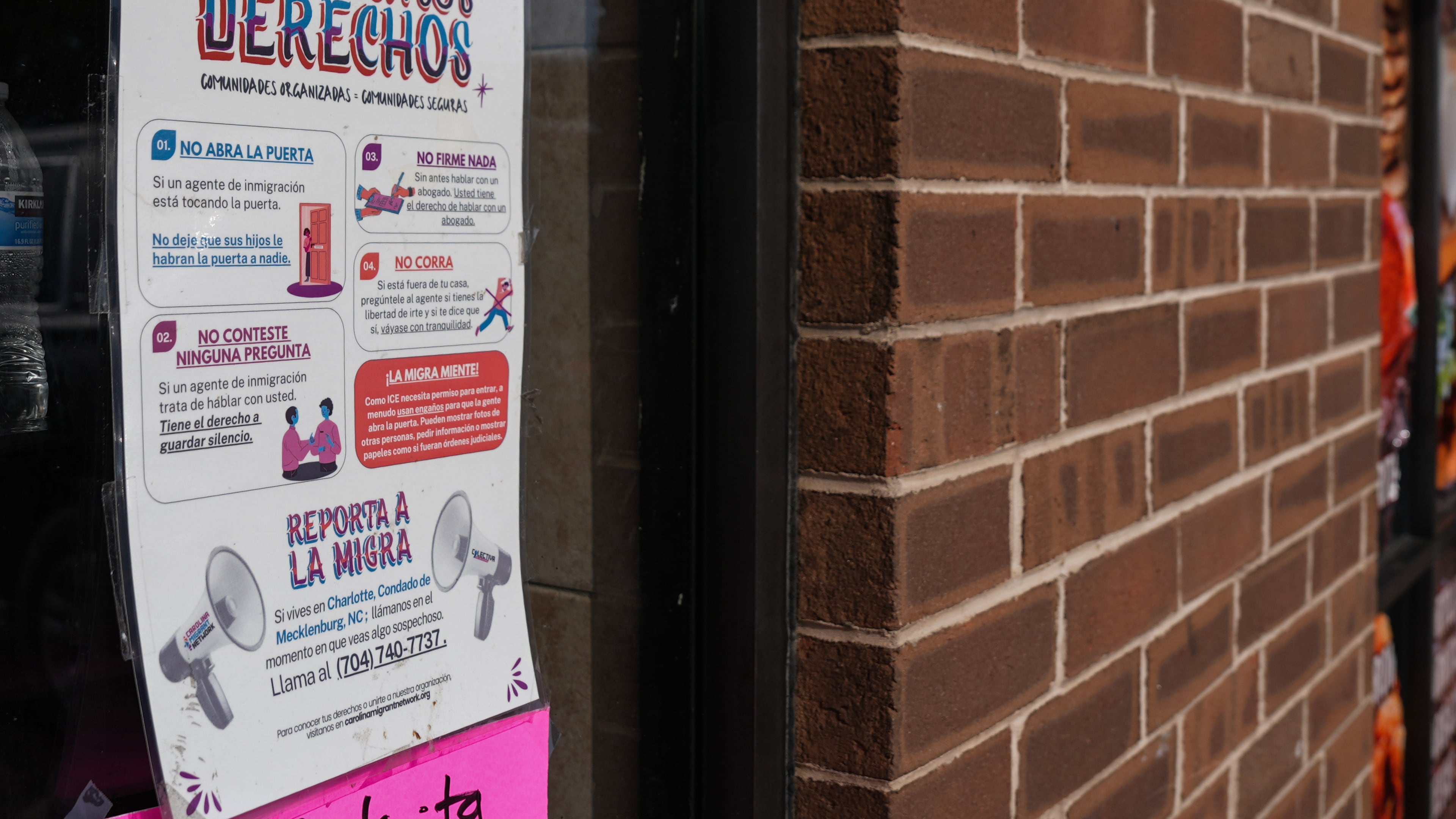 A sign in Spanish that reads at top: "Know Your Rights" is displayed outside of a restaurant store front, Thursday, Nov. 13, 2025, in Charlotte, N.C. (AP Photo/Matt Kelley)