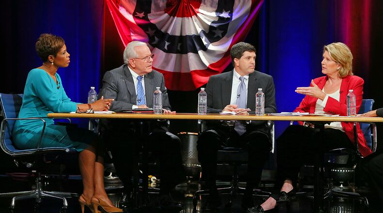 102112 ATLANTA: Panelists Valarie Wilson (from left), President of Georgia School Board Association, Alvin Wilbanks, CEO and Superintendent Gwinnett County Public Schools, Kelly McCutchen, President of Georgia Public Policy Foundation and Jan Jones, Georgia House of Representatives, debate the issues during a televised forum on Georgia's proposed charter school amendment organized by the Atlanta Press Club and hosted at GPB in Atlanta on Sunday , Oct. 21, 2012. CURTIS COMPTON / CCOMPTON@AJC.COM