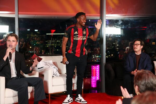Atlanta United midfielder Ajani Fortune models the team's new kit during an unveiling event.