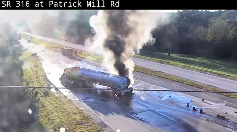 Footage from a Georgia Department of Transportation camera showed heavy black smoke pouring from the tanker at the intersection of Ga. 316 and Patrick Mill Road.