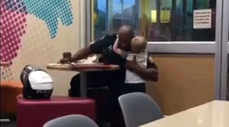 A video of a child hugging a police officer has gone viral.