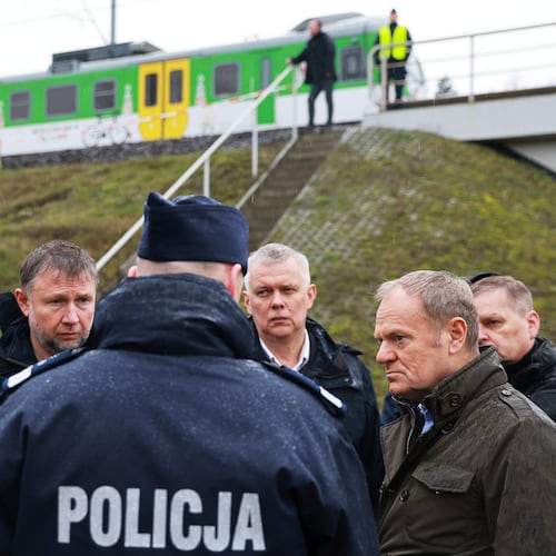 Prime Minister Donald Tusk, second right, visits site of the rail line Mika, that was damaged by sabotage, near Deblin, Poland, Monday, Nov. 17, 2025. (AP Photo/KPRM)