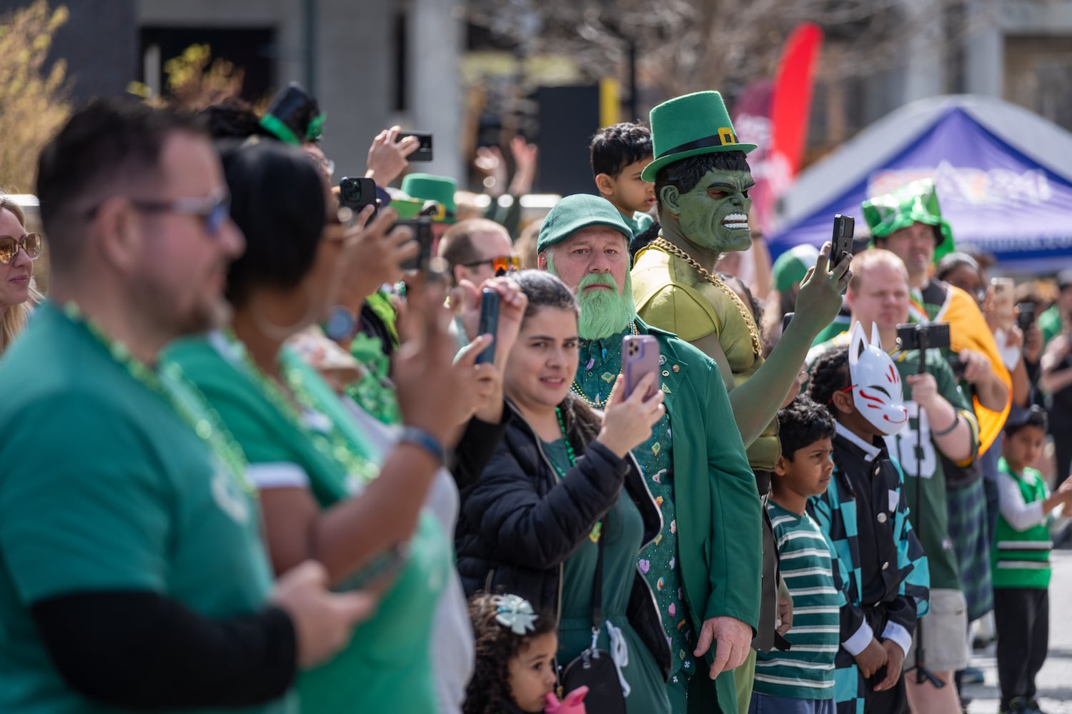 The crowd lines Peachtree Street in Midtown during the Atlanta St. Patrick’s Parade on Saturday, March 14, 2026. (Ben Gray for the AJC)