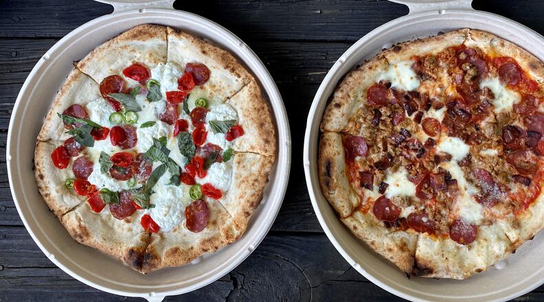Ammazza offers these fuoco bianco and carne pies for takeout. Wendell Brock for The Atlanta Journal-Constitution