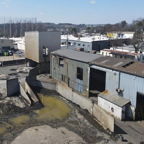 This is a photo of a tire recycling facility along Huber Street in Atlanta that a development team aims to transform into an apartment complex called Alta West Midtown. (Courtesy of Development Authority of Fulton County / Wood Partners)