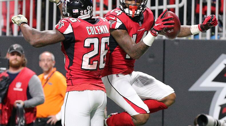Falcons wide receiver Justin Hardy celebrates his touchdown catch with running back Tevin Coleman to take a 17-7 lead over the Cowboys during the third quarter in a NFL football game on Sunday, November 12, 2017, in Atlanta.    Curtis Compton/ccompton@ajc.com