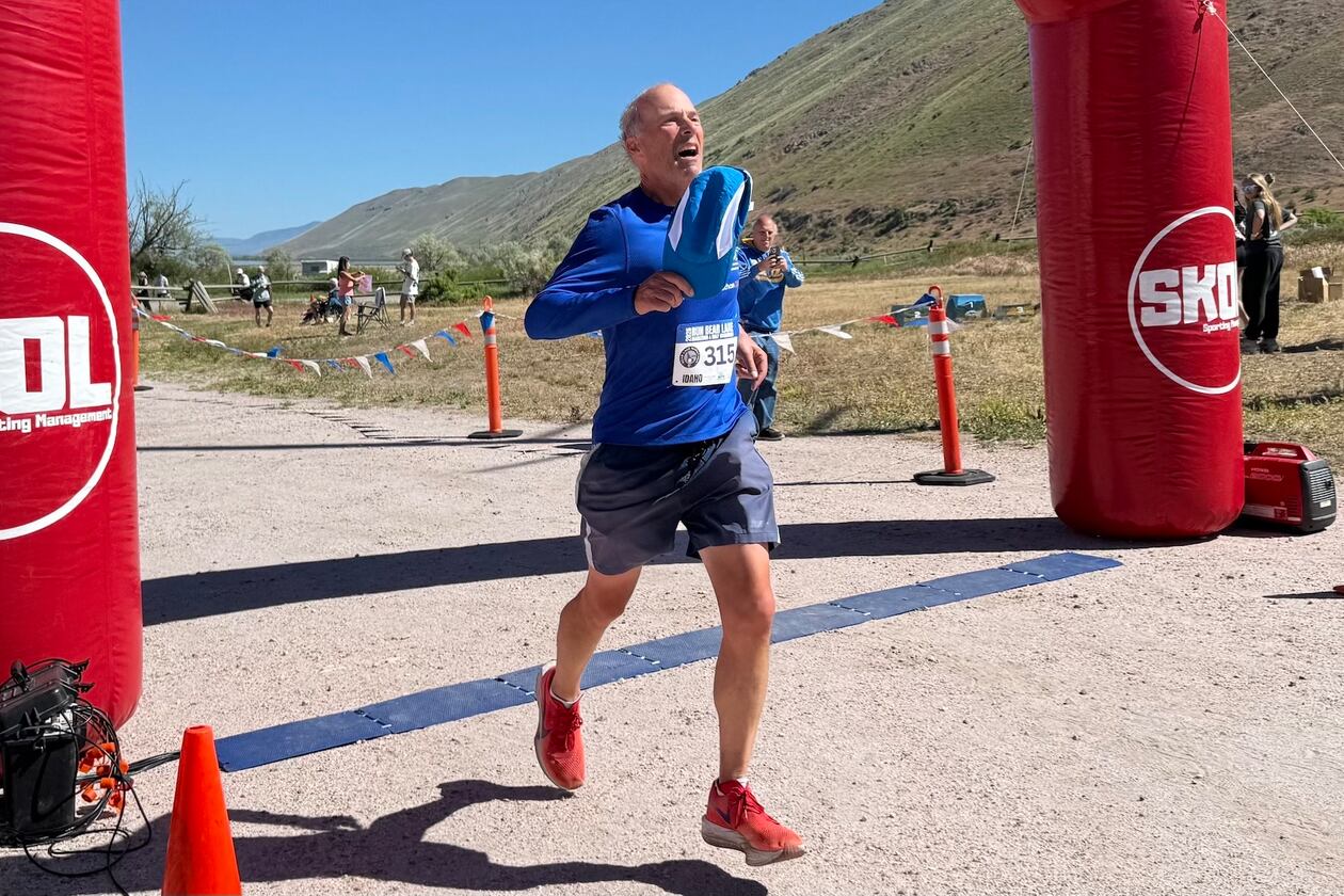 Former Atlanta Journal-Constitution sports writer Mike Knobler completes the Bear Lake Marathon in Idaho on June 5, 2026. It made him a finisher of a marathon in all 50 states and was also the first of his goal to run 26 marathons in 26 countries in 26 weeks. (Courtesy of Tyler Cleveland)