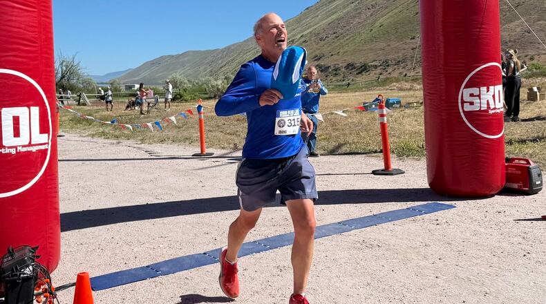 Former Atlanta Journal-Constitution sports writer Mike Knobler completes the Bear Lake Marathon in Idaho on June 5, 2026. It made him a finisher of a marathon in all 50 states and was also the first of his goal to run 26 marathons in 26 countries in 26 weeks. (Courtesy of Tyler Cleveland)