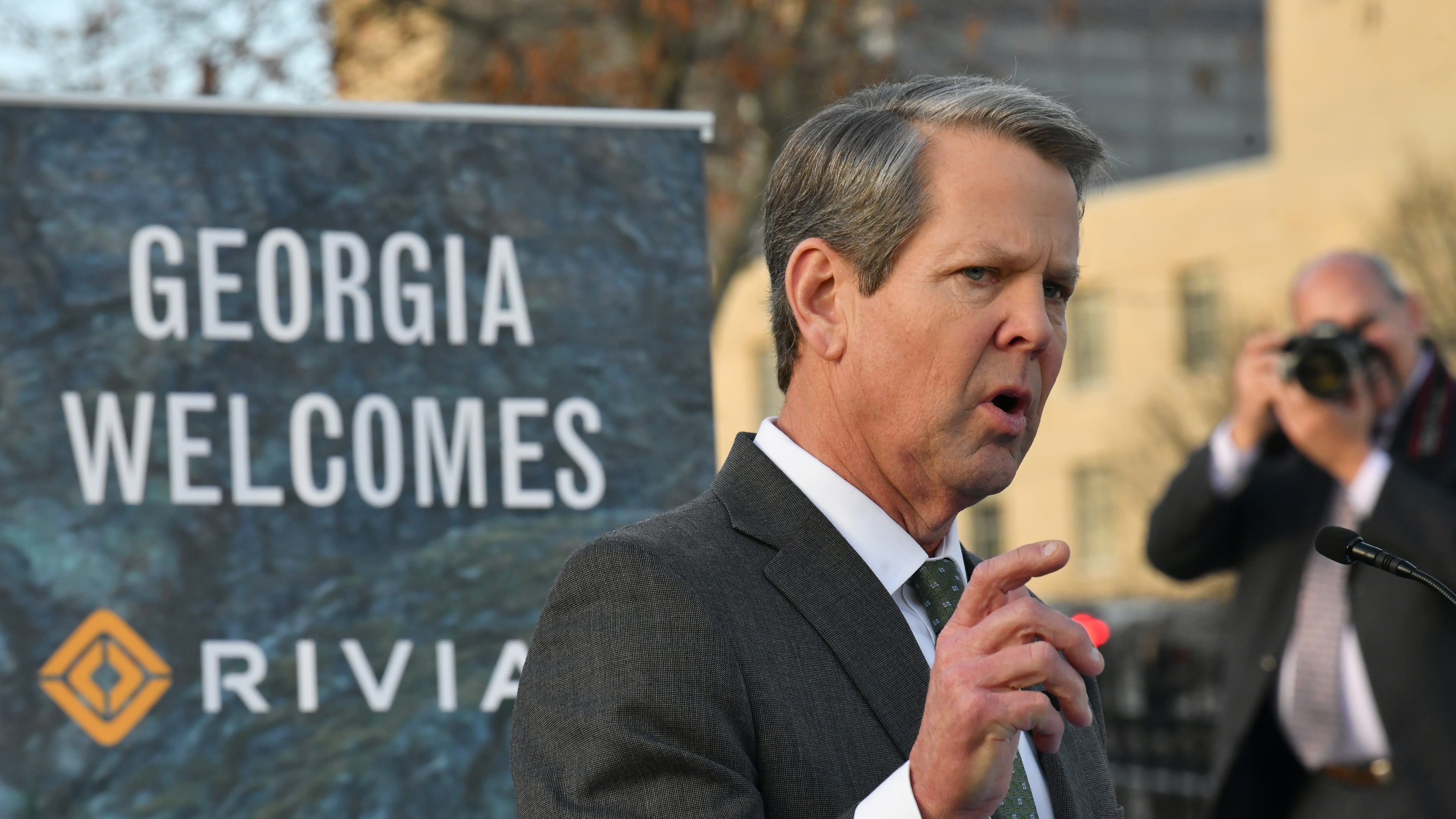 Gov. Brian Kemp spoke a news conference in Atlanta in 2021 about electric vehicle maker Rivian's plan to build a factory in Georgia. (Hyosub Shin/AJC)