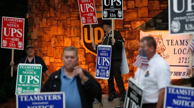 About 60 mechanics drove in from Louisville, Ky., to protest as they try to negotiate their pay contract.