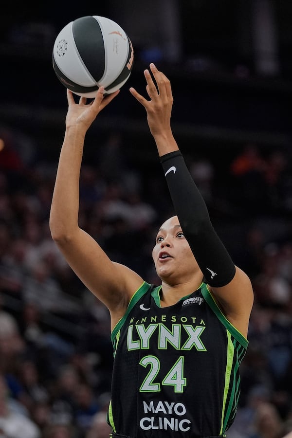 Minnesota Lynx forward Napheesa Collier (24) shoots during the second half of a WNBA basketball game against the Phoenix Mercury, Tuesday, June 3, 2025, in Minneapolis. (AP Photo/Abbie Parr)
