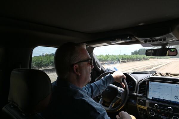 Dan Hodges, owner of Wrigley’s Fields, shows his blueberry farm to AJC reporters on Tuesday, May 5, 2026, in Bristol, Georgia. He established the farm in 2020 in an effort to leave the car dealership industry, and he partnered with MBG Marketing, to whom all of his blueberry harvests are sold. (Hyosub Shin/AJC)