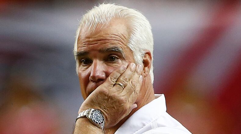 Atlanta Falcons head coach Mike Smith watches play against the Chicago Bears during the first half of an NFL football game, Sunday, Oct. 12, 2014, in Atlanta. (AP Photo/John Bazemore) Mike Smith needs to figure out a way to end his team's losing streak. (AP photo)