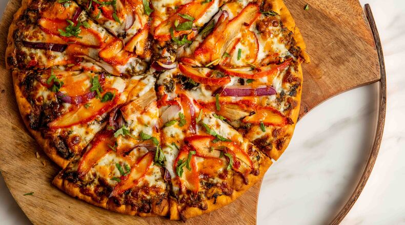 Chili paneer pizza is one of several Indian-inspired pizzas on the menu at Tandoori Pizza and Wings. / Courtesy of Tandoori Pizza and Wings