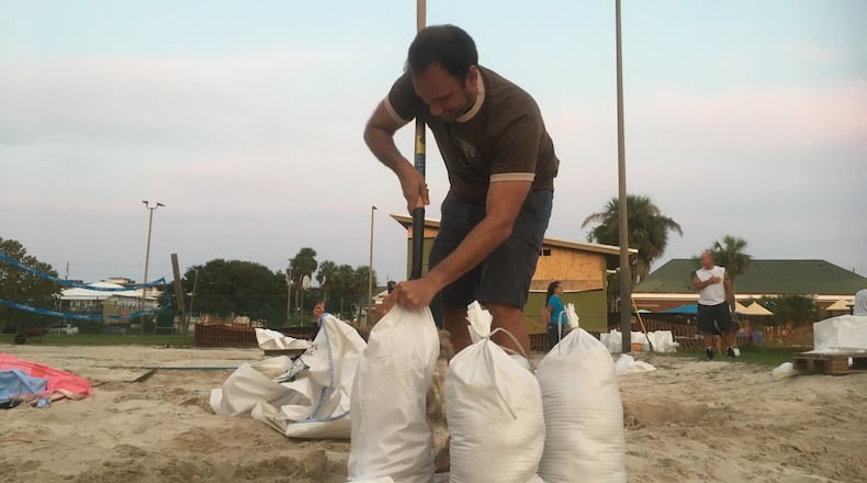 Adam Demico hurried to fill sandbags ahead of Hurricane Irma's approach.