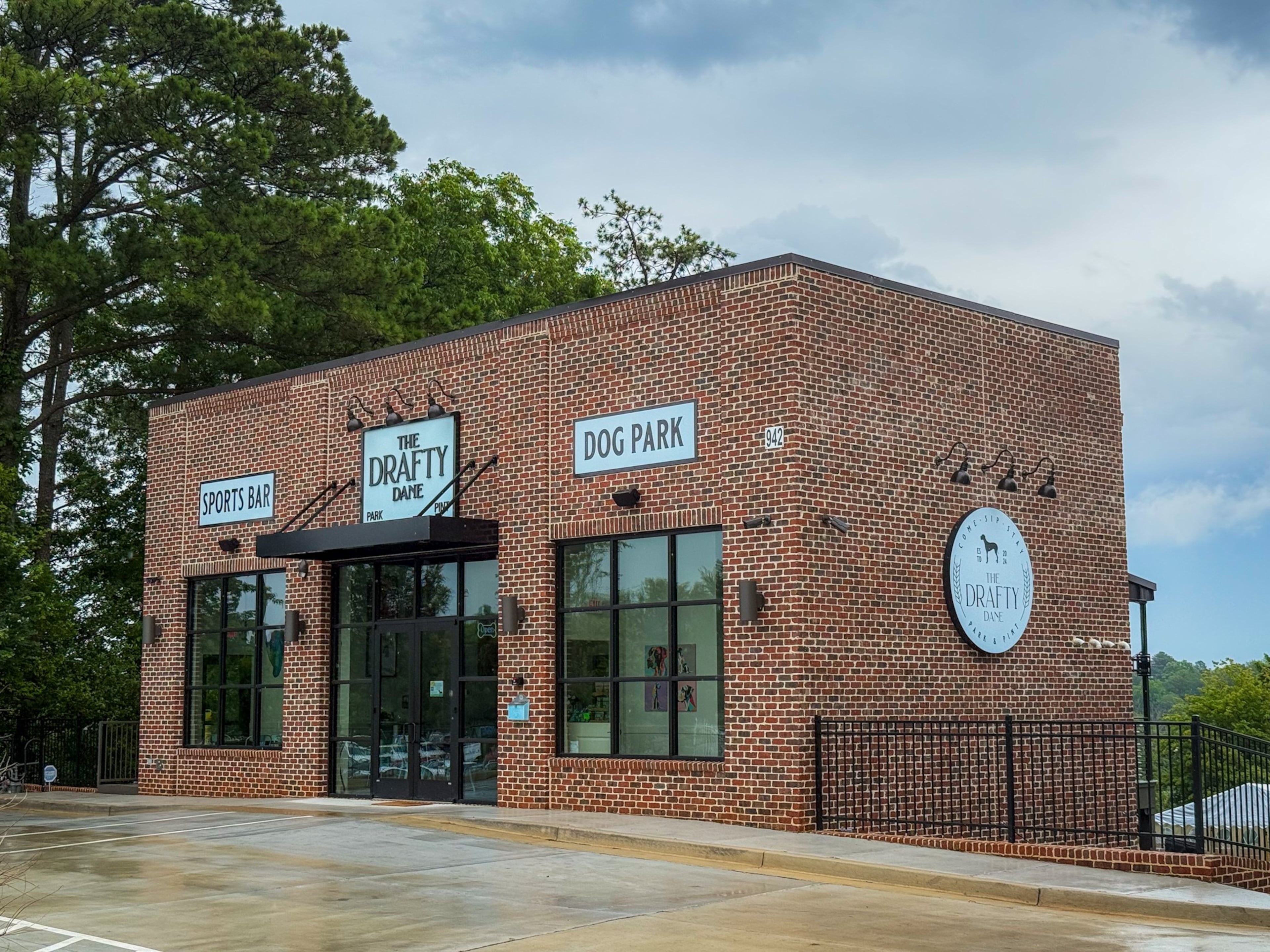 The Drafty Dane in Marietta has a two-story bar flanked by a 21,000-square-foot, off-leash dog park. (Henri Hollis/AJC)