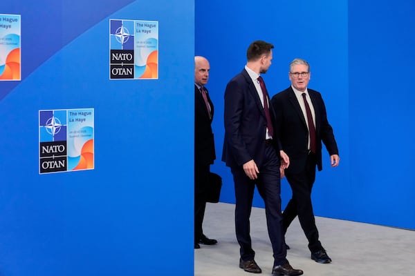 Britain's Prime Minister Keir Starmer, right, arrives for the NATO summit in The Hague, Netherlands, Wednesday, June 25, 2025. (AP Photo/Matthias Schrader)