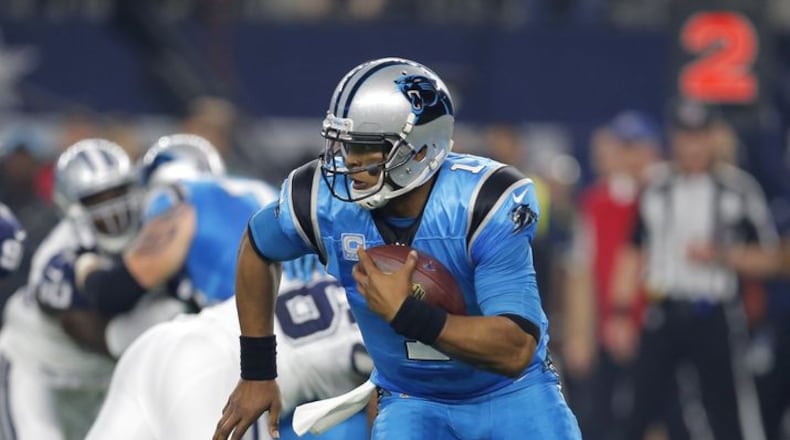 Carolina Panthers quarterback Cam Newton (1) runs the ball under pressure from the Dallas Cowboys during a NFL football game, Thursday, Nov. 26, 2015, in Arlington, Texas. (AP Photo/Brandon Wade)
