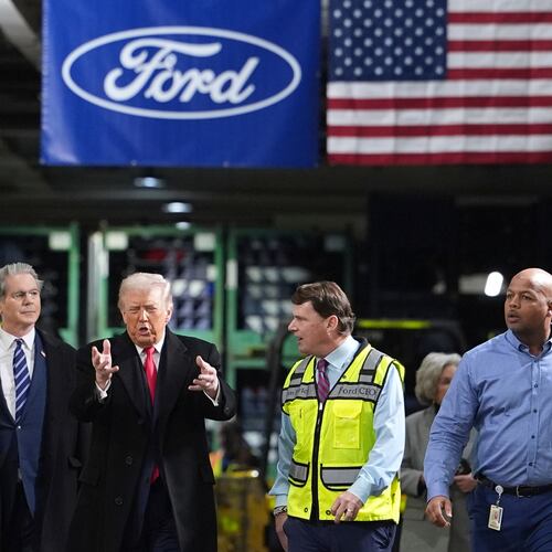 President Donald Trump speaks to, from left Bill Ford, Executive Chairman of Ford, Treasury Secretary Scott Bessent, Jim Farley, CEO of Ford, and Corey Williams, Ford River Rouge Plant Manager, during a tour of the Ford River Rogue complex, Tuesday, Jan. 13, 2026, in Dearborn, Mich. (AP Photo/Evan Vucci)