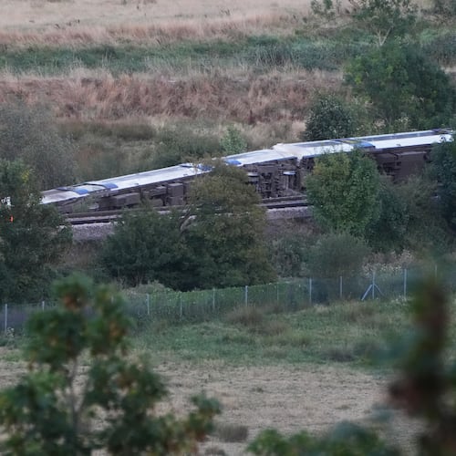 A train with around 150 people aboard derailed near the Lewes, England, railway station in East Sussex on Thursday, Aug. 13, 2026. (Jonathan Brady/PA via AP)