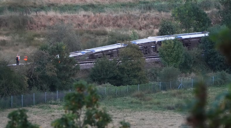 A train with around 150 people aboard derailed near the Lewes, England, railway station in East Sussex on Thursday, Aug. 13, 2026. (Jonathan Brady/PA via AP)