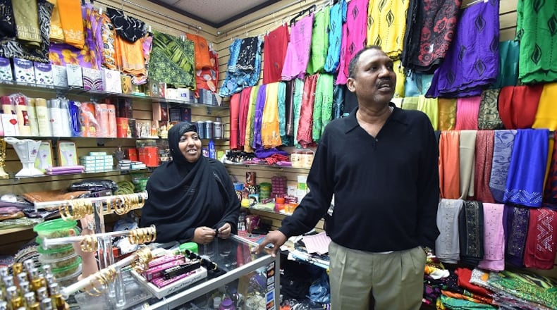 Omar Shekhey (right), executive director for the Somali American Community Center in Clarkston, with Uregi Hagimunye at Campus Plaza in Clarkston on Thursday, April 13, 2017. Shekhey said federal immigration authorities have arrested as many as 10 Somalis in Clarkston, Stone Mountain and in Gwinnett this week alone. HYOSUB SHIN / HSHIN@AJC.COM