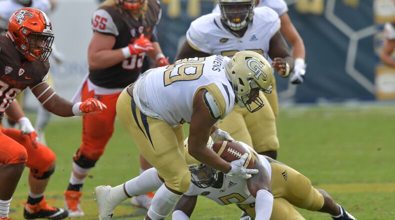 Georgia Tech defensive lineman Antwan Owens (89) recovers the ball after Bowling Green quarterback Jarret Doege fumbled during the second half Saturday, Sept. 29, 2018, at Bobby Dodd Stadium in Atlanta.  Georgia Tech won 63-17 over the Bowling Green.