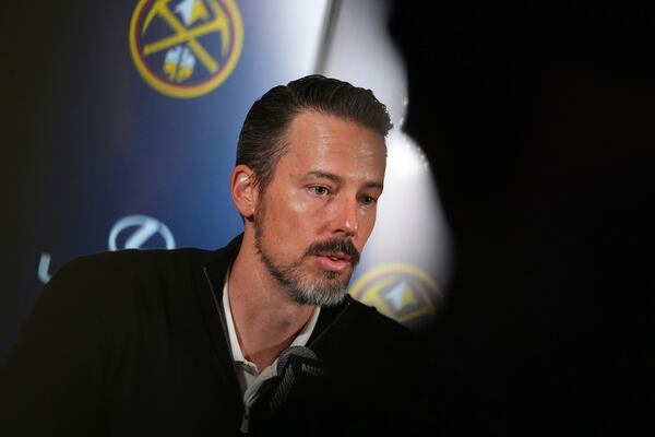 Denver Nuggets team president Josh Kroenke responds to questions at a news conference Monday, April 14, 2025, in Denver about the firing of the team's general manager and head coach last week. (AP Photo/David Zalubowski)