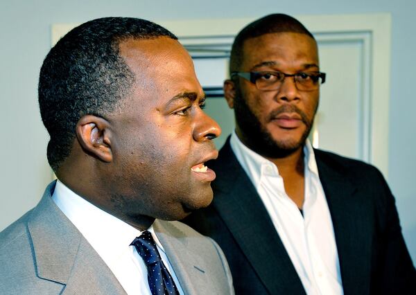 Former Atlanta Mayor Kasim Reed and filmmaker Tyler Perry during a meeting of the McPherson Implementing Local Redevelopment Authority.