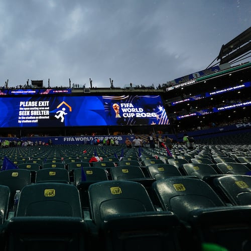 A sign advising fans of a weather delay is displayed during the World Cup Group I soccer match between France and Iraq in Philadelphia, Monday, June 22, 2026. (AP Photo/Derik Hamilton)