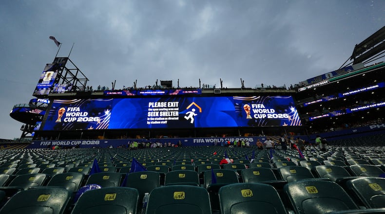 A sign advising fans of a weather delay is displayed during the World Cup Group I soccer match between France and Iraq in Philadelphia, Monday, June 22, 2026. (AP Photo/Derik Hamilton)