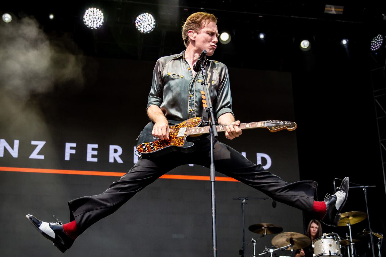 Franz Ferdinand frontman Alex Kapranos jumped around in 90 degree heat, and the Scottish band played a sizzling set of hits and other cuts from its deep catalog at the Shaky Knees Music Festival in Piedmont Park in September 2025. (Ryan Fleisher for the AJC)