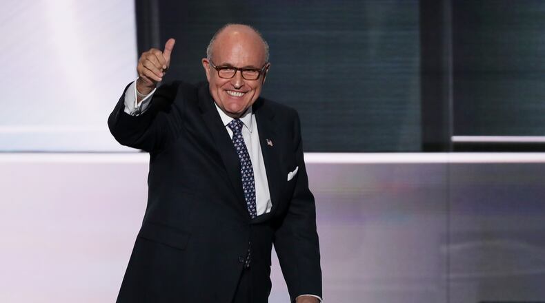 CLEVELAND, OH - JULY 18: Former New York City Mayor Rudy Giuliani gives a thumbs up as he walks on stage to deliver a speech on the first day of the Republican National Convention on July 18, 2016 at the Quicken Loans Arena in Cleveland, Ohio. An estimated 50,000 people are expected in Cleveland, including hundreds of protesters and members of the media. The four-day Republican National Convention kicks off on July 18. (Photo by Alex Wong/Getty Images)