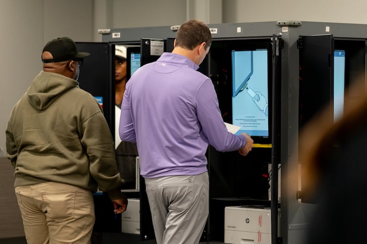 Voters cast their ballots inside the Buckhead Library voting precinct in Atlanta on Monday, Nov. 4, 2025. (Ben Hendren for the AJC)