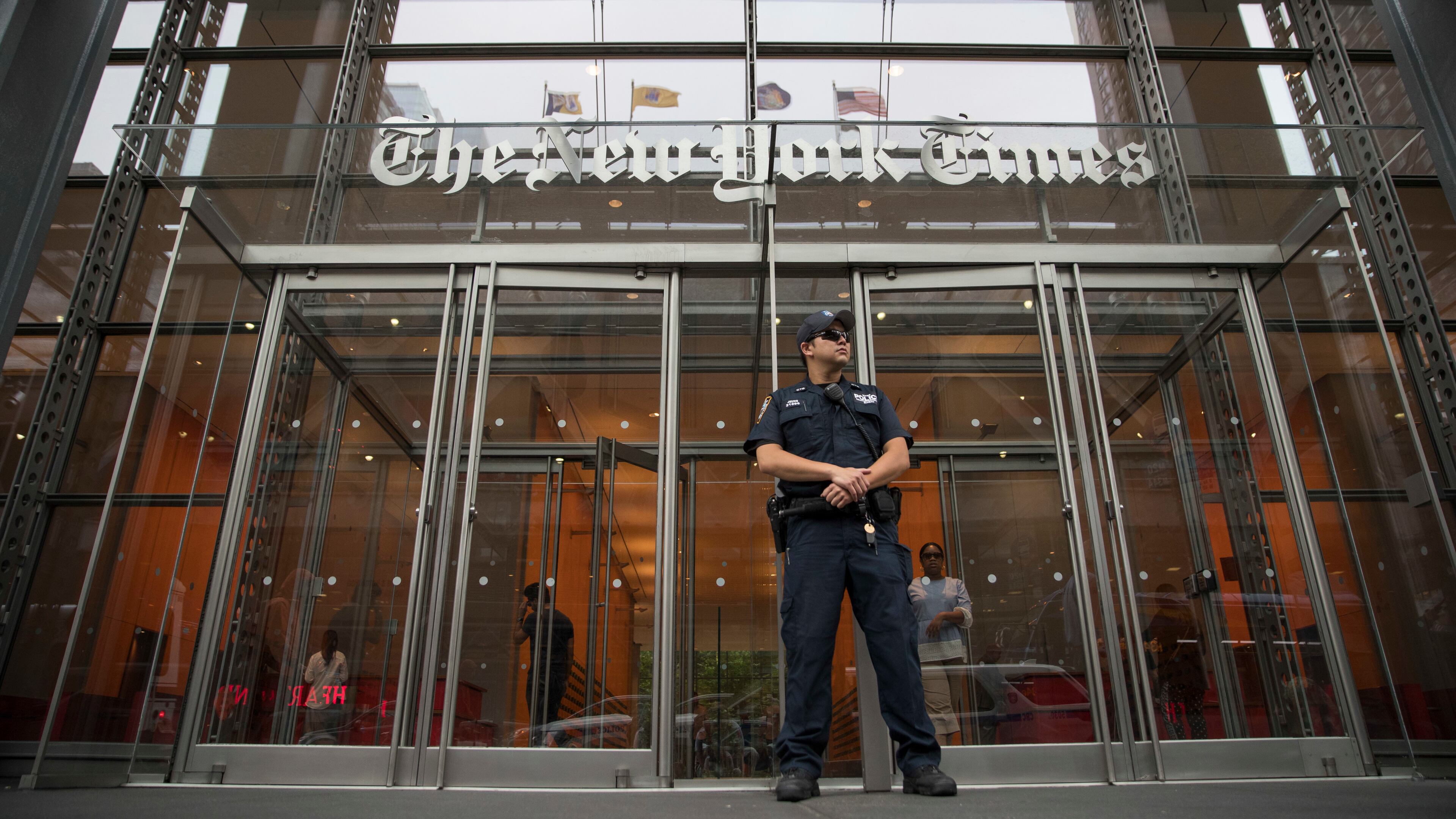 FILE- A police officer stands guard outside The New York Times building in New York, on June 28, 2018. (AP Photo/Mary Altaffer, File)