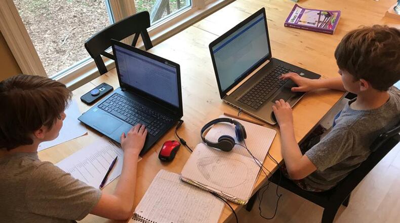 When the new school year begins Aug. 6, students in Forsyth County will have a choice of virtual learning or returning to their classrooms for face-to-face instruction. AJC FILE